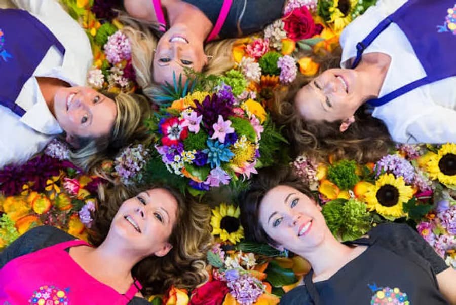 Local florists surrounded by fresh flowers